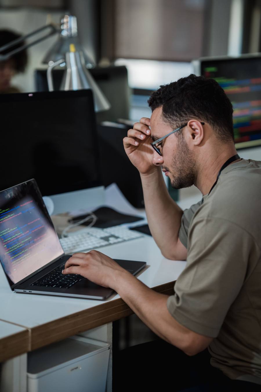 Developer deep in focus debugging code